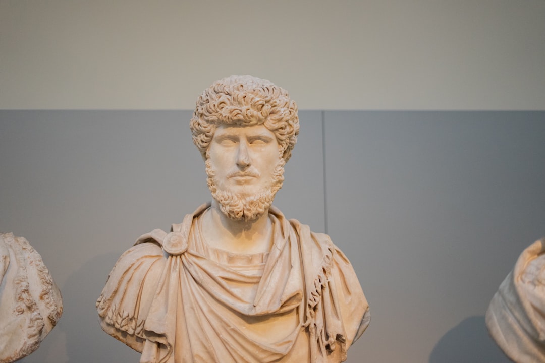 Bust of a man with curly hair and beard